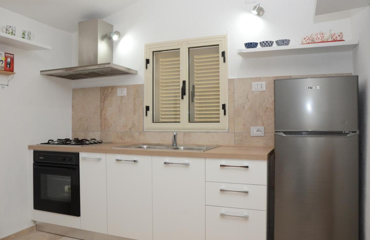 Apartments Villa Corrias Cala Liberotto Bagian luar foto